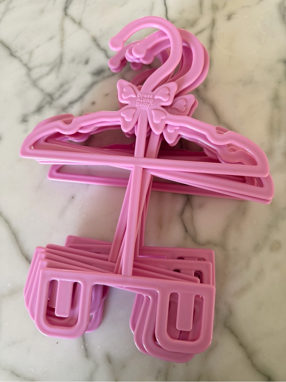 Bundle of doll clothes hangers